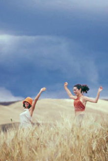 People in sand dunes.